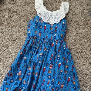 cheeky plum Fireworks Dress with White Lace trim around neck.